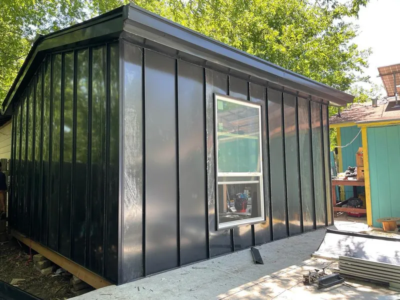 Black standing seam metal wall panels for Roof Inspection in D'Iberville