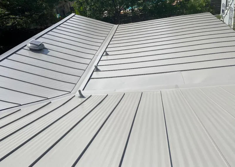 Solar attic fan installed on a metal roof for Roof Ventilation in D'Iberville